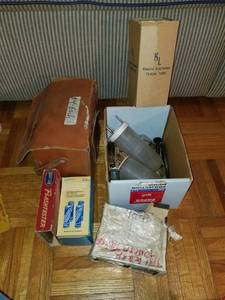 lot 3454 image: Lot of Vintage Flash Bulbs .Rechargeable Battery Dock. Flash Tester. and More
