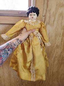 lot 6199 image: Antique Doll with Dandelion Yellow Dress