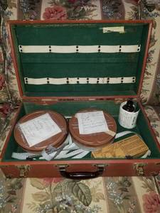 lot 7544 image: Vintage Video Reels with Processing Fluid. wuth Brown Case