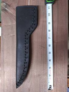 lot 7781 image: Black Smooth Unfinished Sheath Leather 11 Inch with Fish