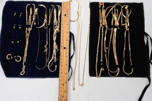 lot 38 image: 2 Gold Tone Bracelet and Necklace Sets  American Showcase & Ambassador  in Velvet Roll-up Travel BagJewelry Pouches