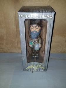 lot 7940 image: Duck Commander Bobble Head. SI ROBERTSON