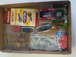 lot 42 image: Kwikset re-key kit , abrasive circular brush , cup hooks , wire twist and more