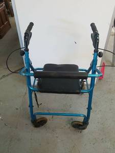 lot 821 image: Evermed walker with seat and hand brakes