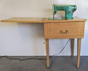 lot 566 image: Retro Aqua Turquoise White Model No. 3355 Heavy Duty Zig-Zag Sewing Machine in Cabinet