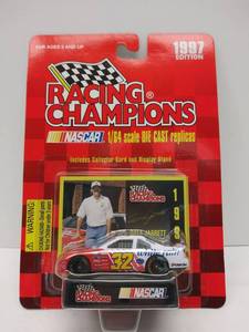lot 555 image: Racing Champions 164 Scale Diecast w Collector Card & Display Stand  1997 Edition  #32 Dale Jarrett