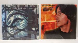 lot 9566 image: 2 1980s Jackson Brown Albums  Hold Out & Lives in the Balance