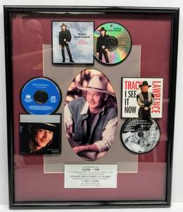 lot 9594 image: Presented To KZSN - FM  Tracy Lawrence I See It Now, Sticks and Stones & Alibis  To Commemorate Contribution to Sales  Wall Hanging