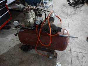 lot 3411 image: Electric Air compressor on wheels.