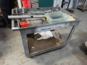 lot 3454 image: Rubber made shop cart W contents.