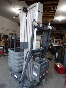 lot 3483 image: JLG AccessMaster ModelAM-30. 30 ft man lift