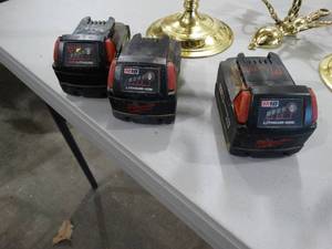 lot 3494 image: 3 Milwaukee M18 batteries.