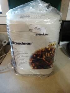 lot 8 image: Breadman ultimate bread maker w book
