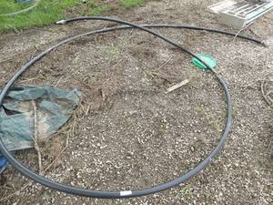 lot 90 image: Large hard plastic hose well hose