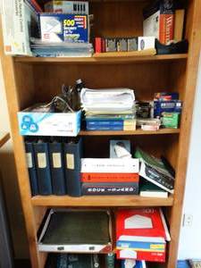 lot 186 image: Large lot of office supplies on bookshelf