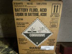lot 1271 image: Partial container of battery acid