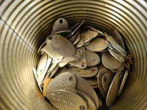 lot 1288 image: Coffee can of Boeing metal plates
