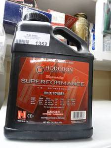 lot 1352 image: Partial container of Hodgdon rifle powder