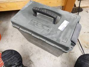 lot 1400 image: Ammo container w contents- gun rests & misc.