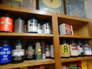 lot 1464 image: LARGE lot of assorted partial jugs of gun powder