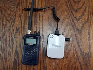 lot 9780 image: Uniden Nascar Walkie Talkie And Aluratek Portable Battery Charger
