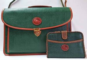 lot 100 image: Briefcase & Small ClutchWallet  Label Says Dooney & Bourke & Metal Duck Says  All Weather Leather NOT Authenticated