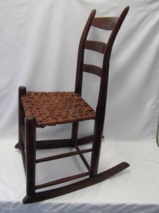 lot 107 image: Vintage Ladder Back Wood Rocking Chair w Woven Seat
