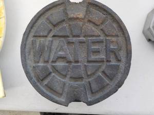 lot 6243 image: Cast Iron water meter cap 7 wide x 4 deep