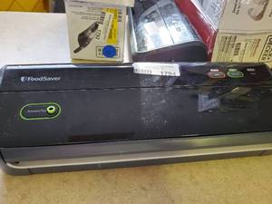 lot 1794 image: Food saver plugged in test ok