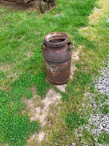 lot 119 image: Antique milk can