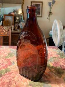 lot 218 image: Large Brown Syrup Bottle