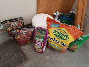 lot 1550 image: 2 Bags Ceramic Briquettes and Partial Bags Grass Seed and Potting Mix