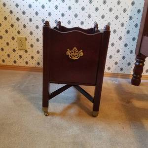 lot 1713 image: the Bombay company magazine rack on Caster wheels