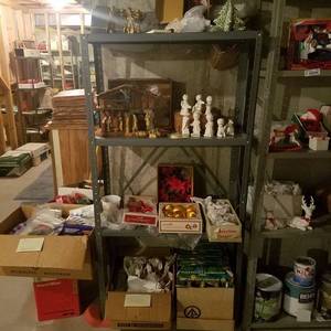 lot 1883 image: Metal shelf and contents - lots of Christmas decor - in Basement