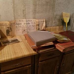 lot 1887 image: all scrapbooks and newspaper clippings on cabinet