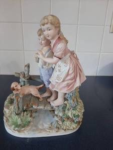 lot 1761 image: Boy and Girl with Dog Figurine