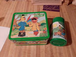 lot 1836 image: Aladdin Sesame Street Metal Lunchbox with Thermos