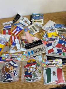 lot 1638 image: many country pride stickers, magnets, etc