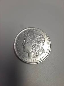 lot 148 image: 1891-O Morgan Silver Dollar