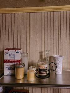 lot 2015 image: Assorted candles candleholders and vases