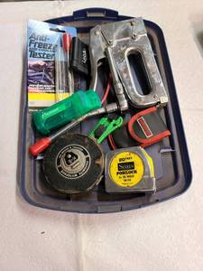 lot 3029 image: Staple gun, measuring tape And assorted garage items
