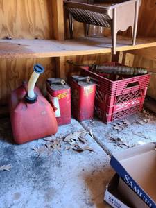 lot 4010 image: Assorted gas cans and oil dispenser
