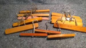 lot 284 image: Vintage 1950s and Assorted Date Clamping Clothes Hangers for Pants Lot of 12