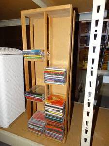 lot 3044 image: Wooden CD Rack with Misc. CDs