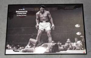 lot 123 image: Muhammad Ali  1965 1st Round Knockout Against Sonny Liston (36 x 24)  Poster in Plastic Frame