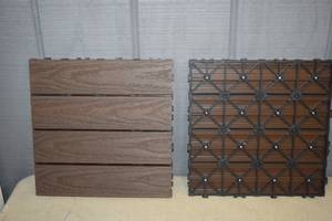 lot 249 image: 10 Pieces Composite Deck Tiles 9.7 square feet Walnut
