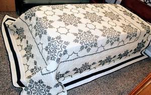 lot 6067 image: Vintage Ivory, Tan and Black Hand Cross Stitched Quilt Bedspread 98 x 108