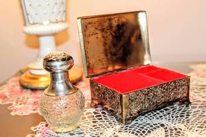 lot 6105 image: Vintage Lined Metal Trinket Jewelry Box and Avon Perfume Bottle