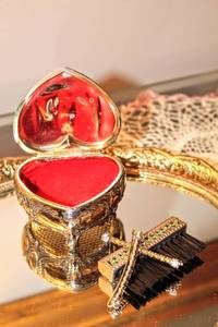 lot 6111 image: Vintage Vanity Dressings including Vintage Heart Shaped Footed Jewelry Box, Vintage Rhinestone Hand Brush, Pair of Rhinestone Hair Pins