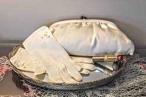 lot 6117 image: Vintage Ensemble including White Satin Clutch Purse, Matching Gloves and Lipstick